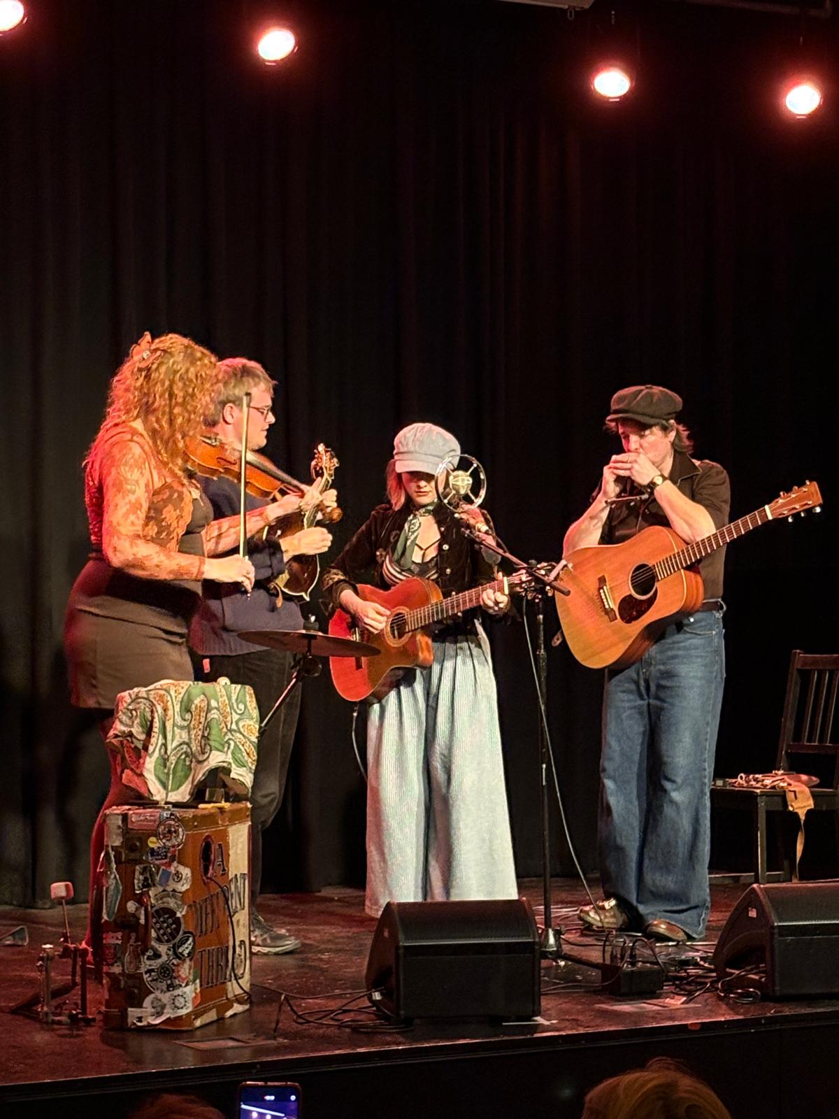 Both duos performing together near the end of the evening