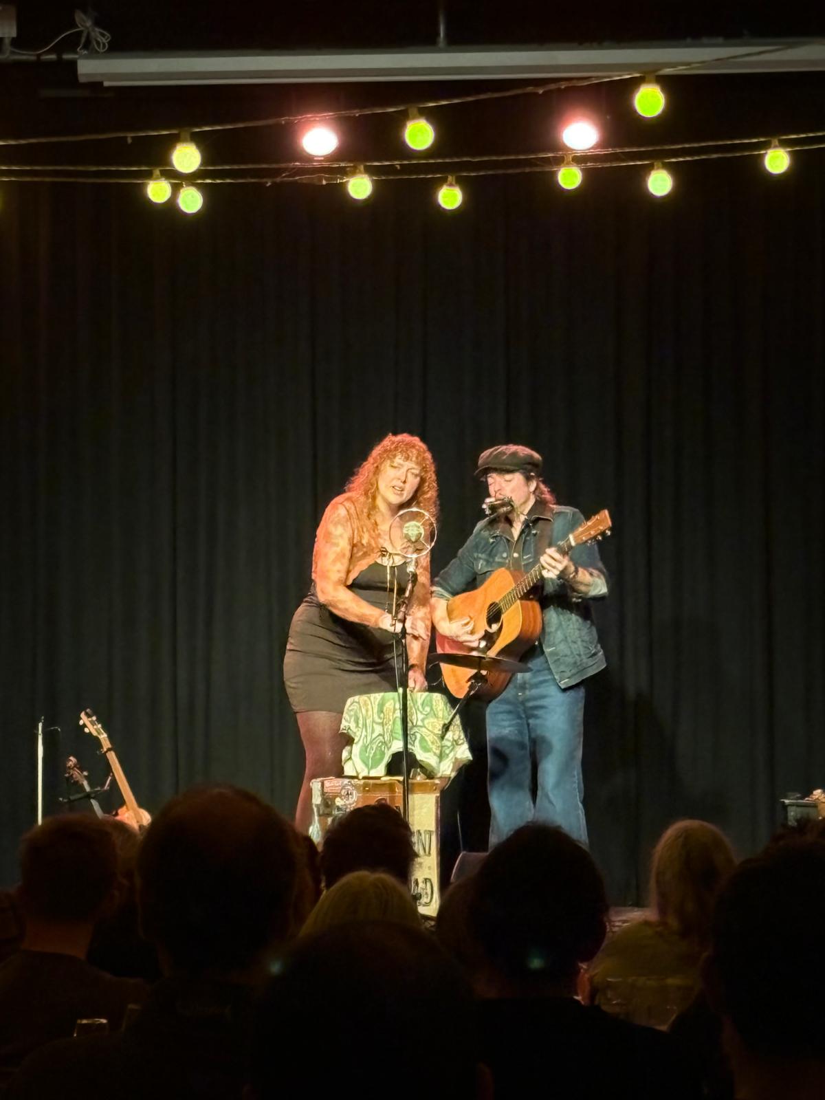 Alicia Best and Robert Jackson sharing the stage microphone